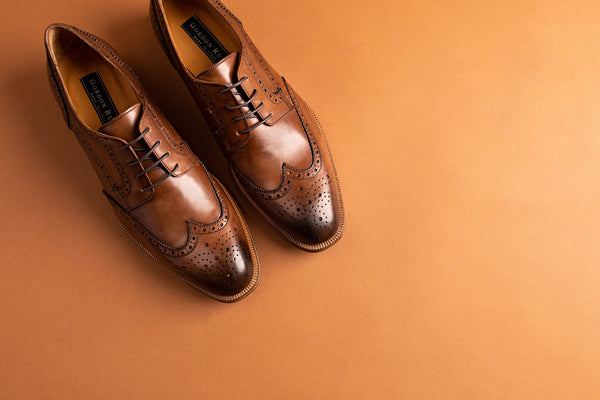 What color shoe goes with a navy suit?