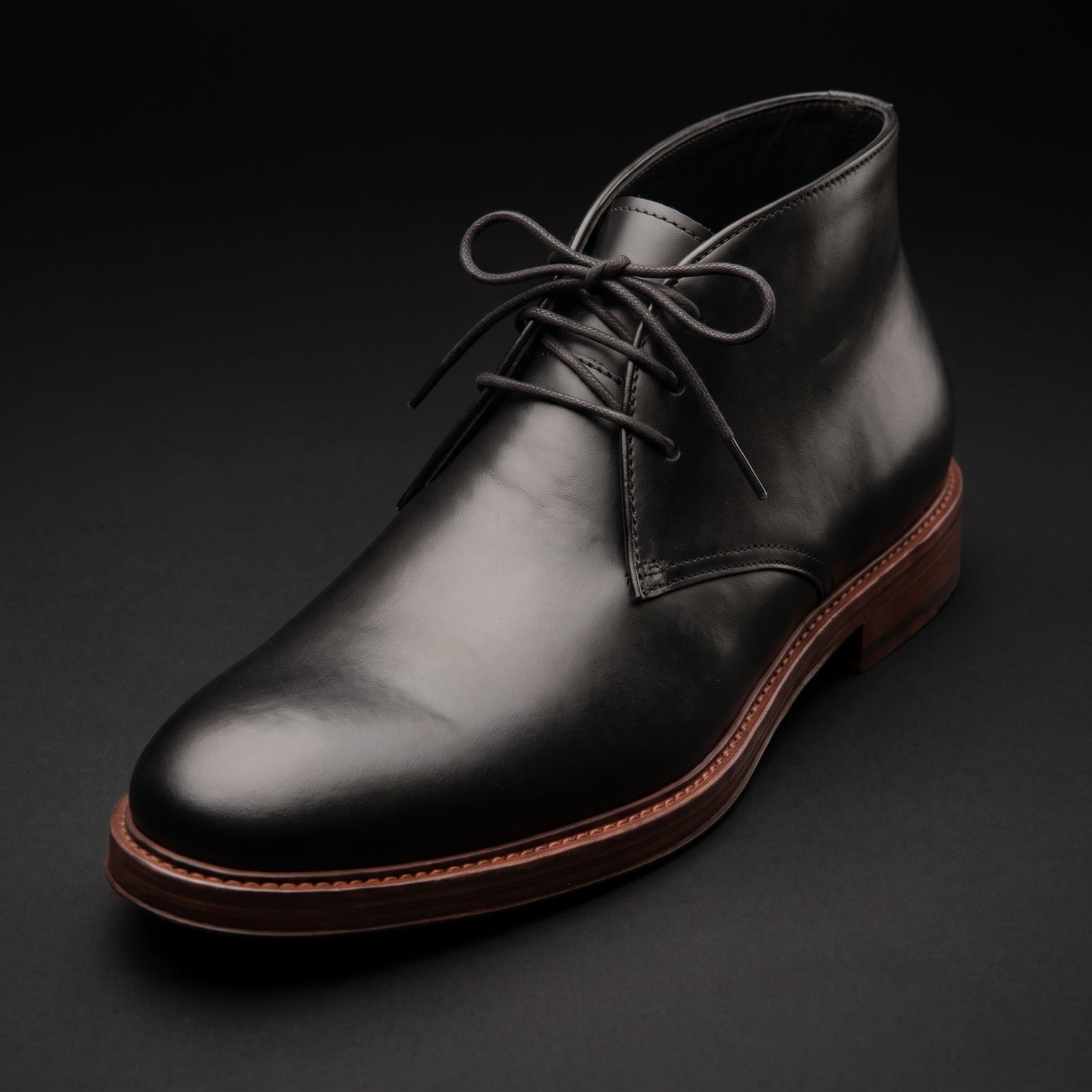 The Austin chukka in black leather, neatly laced